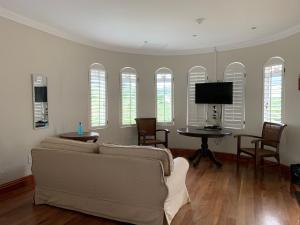 a living room with a couch and a table at Springside House in Hillcrest
