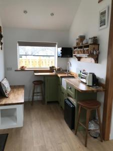 a small kitchen with a counter and a window at The Nook at Claremont House CA12 4LT in Keswick