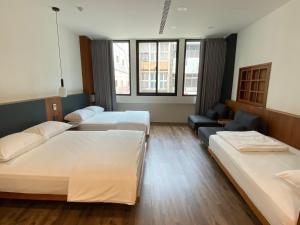 Postel nebo postele na pokoji v ubytování De Provintia Straat B&B