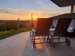 The sunrise or sunset as seen from az apartmanházakat or nearby
