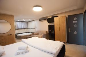 a room with a kitchen and a living room at אחוזת האושר in Tiberias +102 photos