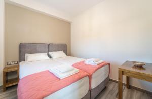 Postel nebo postele na pokoji v ubytování CARLOS MANSION LUXURY SUITES