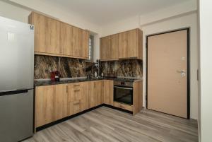 Kuchyň nebo kuchyňský kout v ubytování CARLOS MANSION LUXURY SUITES