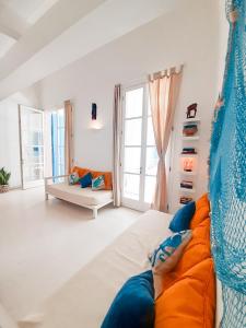 a living room with a bed and a couch at App Rosanna, Estoril Beach, 2steps from the sea, Free Wi-Fi & AC in Sal Rei