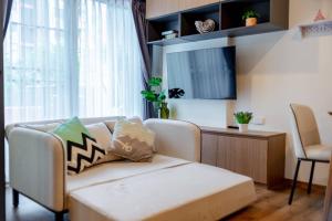 Ένα ή περισσότερα κρεβάτια σε δωμάτιο στο Cicada Huahin Pool Access by PP ห้องสวยติดสระ