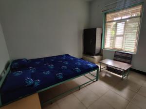Łóżko lub łóżka w pokoju w obiekcie Sakhey Homestay