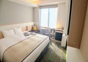 Voodi või voodid majutusasutuse Urban Hotel Kyoto Gojo Premium toas