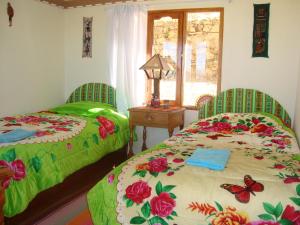 Giường trong phòng chung tại IMPERIO del SOL