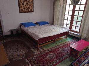 Postel nebo postele na pokoji v ubytování Julay Guest House