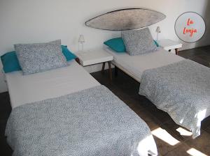 Ein Bett oder Betten in einem Zimmer der Unterkunft La Lonja