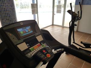 an exercise machine in a gym with a treadmill at Vera Rental Thalassa II in Vera