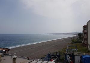 a view of a beach with the ocean at Ahm7nani in Mascali