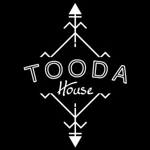 a black and white logo for a toda house at TOODA House in Imsouane