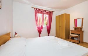 Posteľ alebo postele v izbe v ubytovaní Apartman Nina 2