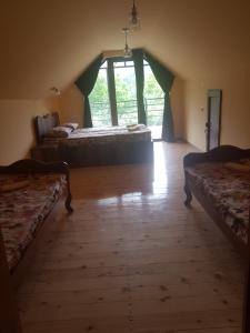 Postel nebo postele na pokoji v ubytování Guest House Sando