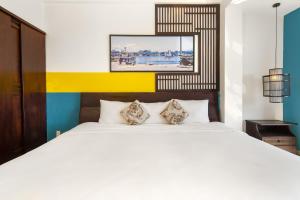 Ένα ή περισσότερα κρεβάτια σε δωμάτιο στο Thanh Lan Riverside Hotel Da Nang +31 φωτογραφίες