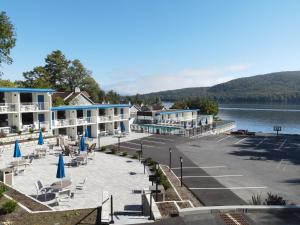 arial view of a resort on a lake with chairs and umbrellas at Lakefront Terrace Resort in Lake George