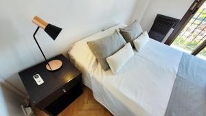 Una cama o camas en una habitación de Studio Uriarte Palermo Soho