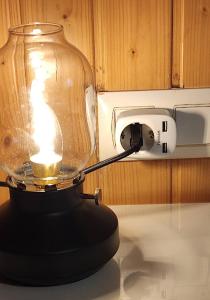 une lanterne sur un comptoir avec une lumière. dans l'établissement Holiday Home Vigo Currás Street, à Vigo