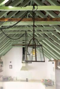 a chandelier hanging from a ceiling in a garage at Boutique house junto al mar in Barbate