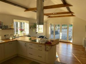 a kitchen with a sink and a counter top at Brooks House formerly The Red Lion in St Margarets at Cliff