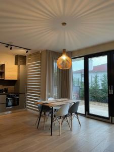a kitchen and dining room with a table and chairs at Buena Vista Villas in Varna City
