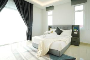 Desaru KTV Classical Elegant Style by Joyfully 2M2客房内的一张或多张床位