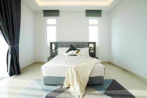 Desaru KTV Classical Elegant Style by Joyfully 2M2客房内的一张或多张床位