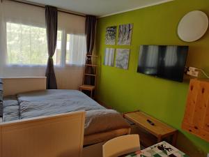 Μια τηλεόραση ή/και κέντρο ψυχαγωγίας στο Condominio I Dadi - Appartamento a Cielo Alto