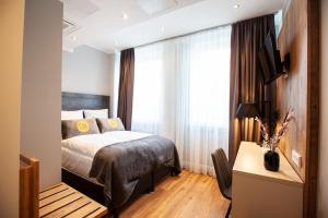 Postel nebo postele na pokoji v ubytování DORMERO Hotel Bremen