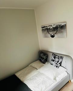 a bed in a corner of a room at FeWo Alte Bäckerei in Dessau
