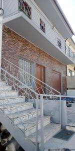 a group of stairs in front of a brick building at Anjú-Pardal in Mogadouro