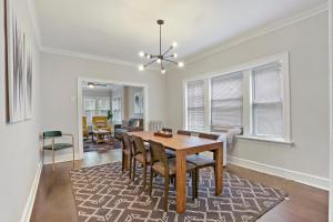 a dining room with a table and chairs at Comfy & Artistic 2BR Home With Wi-Fi! - Francisco 1 in Chicago