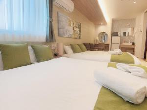 Postel nebo postele na pokoji v ubytování HOTEL CLA-SS HIROSHIMA-TOKAICHI
