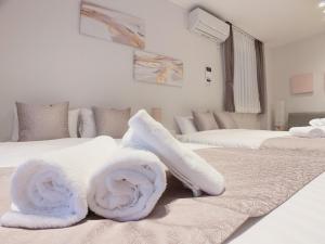 Postel nebo postele na pokoji v ubytování HOTEL CLA-SS HIROSHIMA-TOKAICHI