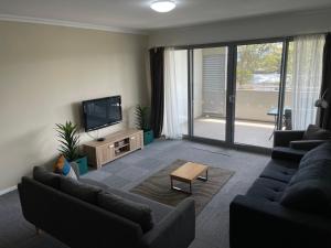 Atpūtas zona naktsmītnē Morisset Serviced Apartments