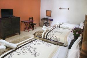 Katil atau katil-katil dalam bilik di Hotel Campestre Las Flores