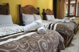 Ένα ή περισσότερα κρεβάτια σε δωμάτιο στο Hotel Campestre Las Flores