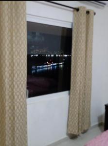 a window in a room with a view of a city at Sierra 2 in Acapulco