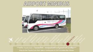a white bus parked in a parking lot at BAAN64 Hostel in Hat Yai