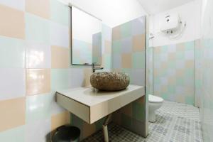 a bathroom with a sink and a toilet at Dream CoWork Hotel in Kuta Lombok +79 photos