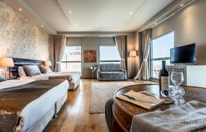a large hotel room with a bed and a couch at My Jerusalem View in Jerusalem +55 photos