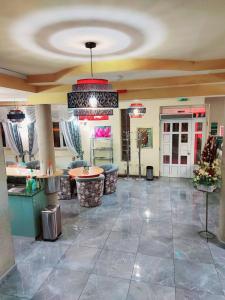a lobby of a hotel with a ceiling at Hotel Villa Valpovo in Valpovo