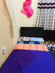 Postel nebo postele na pokoji v ubytování Bathiya Tourist Guest Anuradhapura