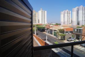 a view of a city street from a balcony at AnaLuiza Smarthome in Sao Jose do Rio Preto
