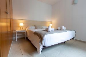 Ένα ή περισσότερα κρεβάτια σε δωμάτιο στο Outdoor Apartaments - Comfort