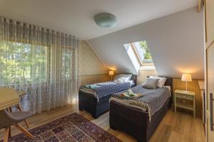 a living room with two beds and a window at Nuutri Villa in Kärdla