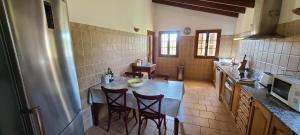 A kitchen or kitchenette at Son Set Villa