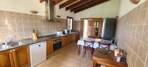 A kitchen or kitchenette at Son Set Villa