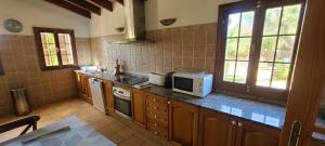 A kitchen or kitchenette at Son Set Villa